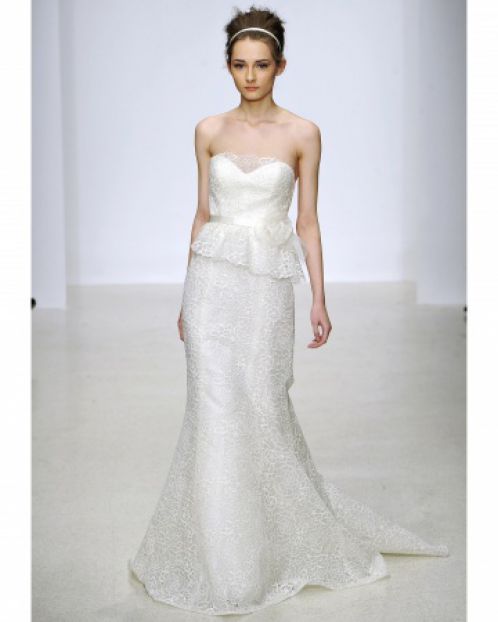 A wedding dress with a lace peplum by Christos, Spring 2013